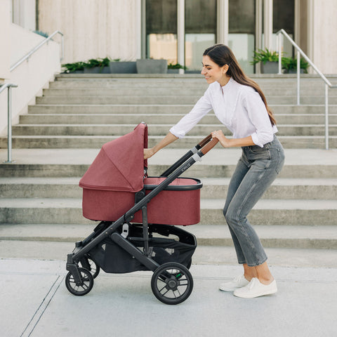 Woman with UPPAbaby Bassinet on Cruz Stroller in LUCY