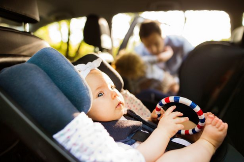Baby in car seat in toy