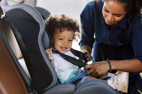 Happy baby in car seat