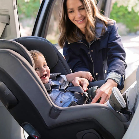 Buckling child into rear facing car seat